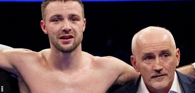 Josh Taylor celebrates with manager Barry McGuigan