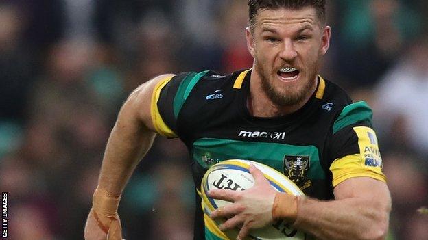 Rob Horne makes a break for Northampton