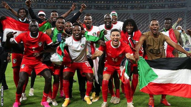 Sudan players celebrate qualifying for the Fifa Arab Cup