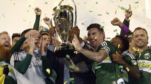 Liam Ridgewell lifts the MLS Cup