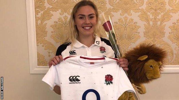 Rosie Galligan with an England shirt, rose and lion