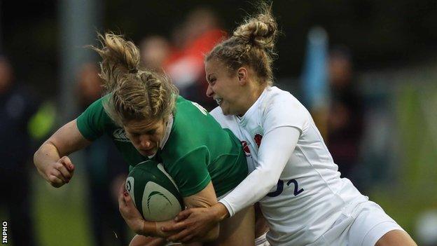 Ireland's Alison Miller is tackled by England's Kay Wilson in Sunday's game at the UCD Bowl