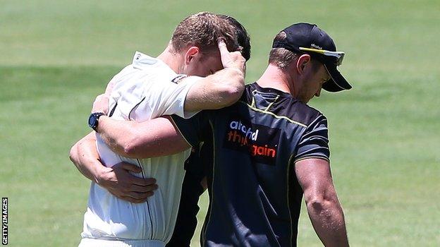 Adam Voges is helped from the field