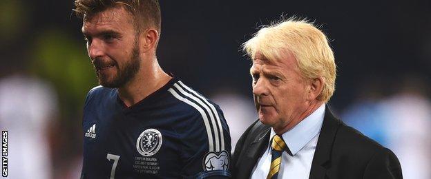 James Morrison trudges off the Hampden pitch beside Scotland manager Gordon Strachan