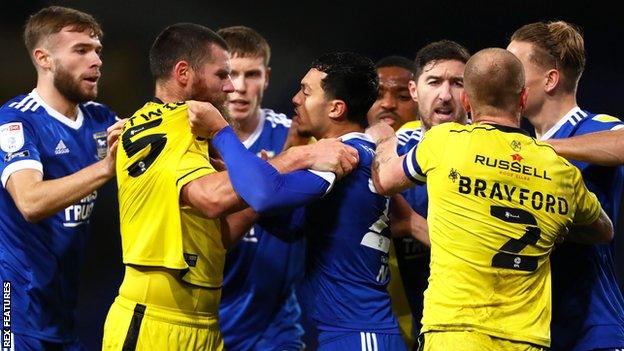 Ipswich and Burton players clash