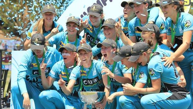 Brisbane Heat celebrate with the WBBL trophy