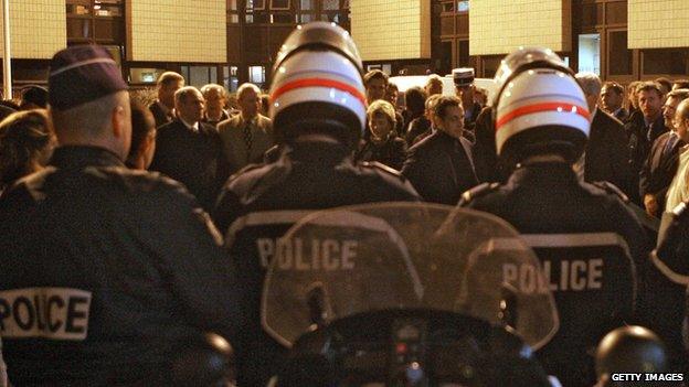 Nicolas Sarkozy speaks to police and firemen in Cergy after rioting in November 2005