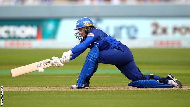 Tammy Beaumont playing a sweep shot for London Spirit