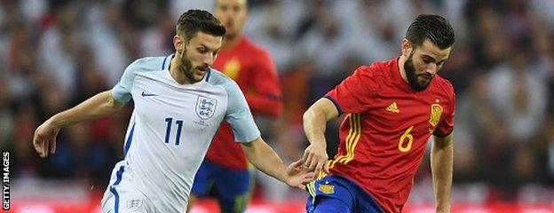 Adam Lallana (left) in action against Spain