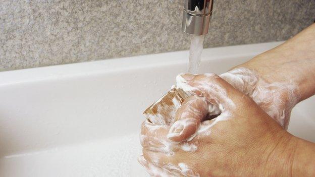 Washing hands at a sink