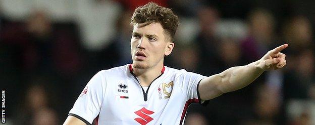 Sam Gallagher in action for MK Dons