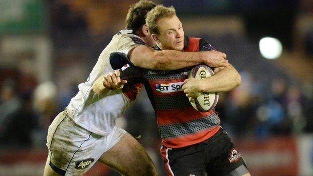 Edinburgh's Greig Tonks (right) is tackled by Marc Baget