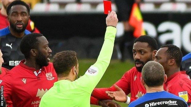 Yann Songo'o is sent off by referee Paul Howard