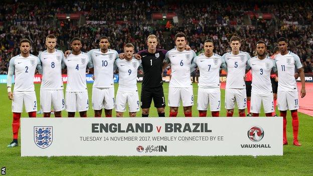 England line up before kick-off against Brazil