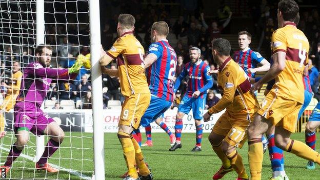 Owain Fon Williams parries Scott McDonald's header