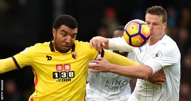 Troy Deeney challenges Robert Huth during Watford's 2-1 win over Leicester in November