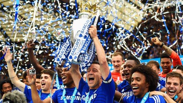 John Terry lifting the Premier League trophy