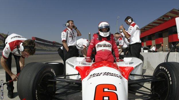 Gil de Ferran climbs from his Team Penske Toyota GForce at the California Speedway in Fontana, California in 2003.