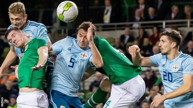 Republic of Ireland's Darragh Lenihan and Shane Duffy with George Saville, Jonny Evans and Craig Cathcart of Northern Ireland