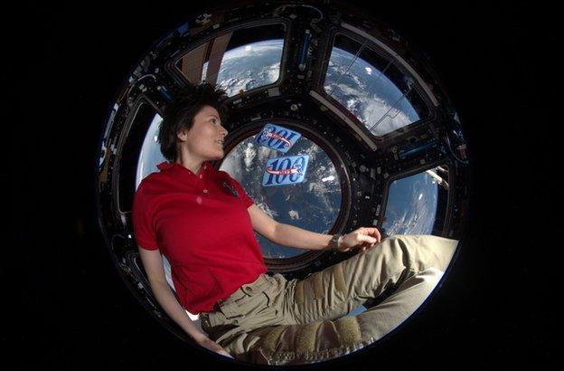 Samantha Cristoforetti sitting in the ISS