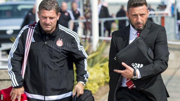 Aberdeen assistant Tony Docherty and manager Derek McInnes at Aberdeen Airport