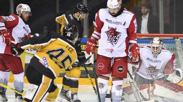 Stephen Dixon attempts to block a shot from Panthers' Steve Lee