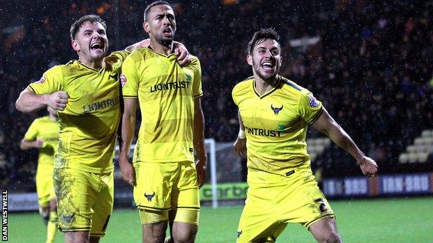 Oxford's players celebrate Kemar Roofe goal, which sealed a 4-2 win over Notts County