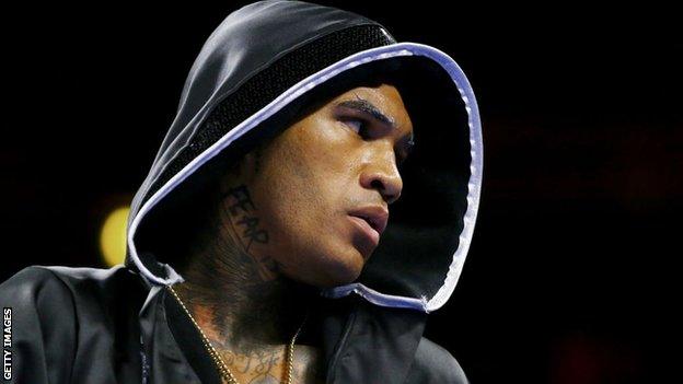 Conor Benn in a hood as he enters the ring