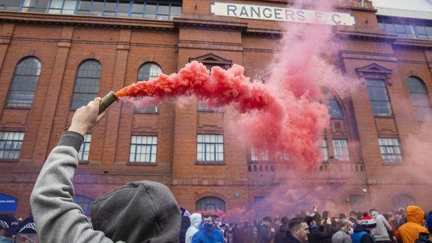 Some fans gathered outside Ibrox to celebrate Rangers' title win