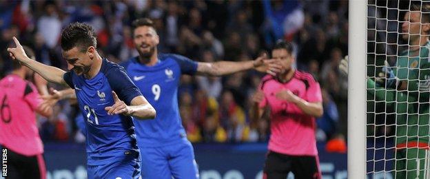 Laurent Koscielny celebrates scoring for France against Scotland