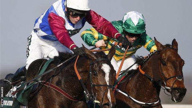 Derek Fox riding One For Arthur (L) clear the last to win The Grand National