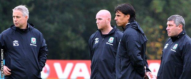 Chris Coleman with Kit Symons (L), John Hartson and Osian Roberts (R)