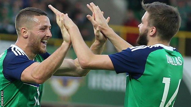 Conor Washington celebrates his goal against Belarus with NI team-mate Stuart Dallas