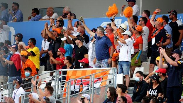 Max Verstappen fans, wearing orange cheer on the Dutch driver at the French Grand Prix