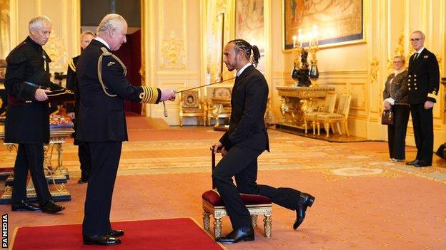 Lewis Hamilton received his knighthood from Prince Charles at Windsor Castle