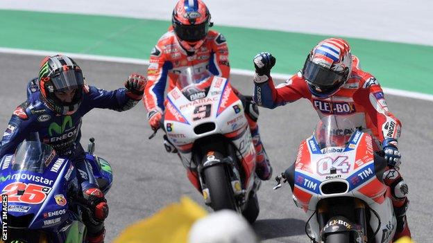 Ducati's Andrea Dovizioso (right) celebrates with Movistar Yamaha's Spanish rider Maverick Vinales (left)