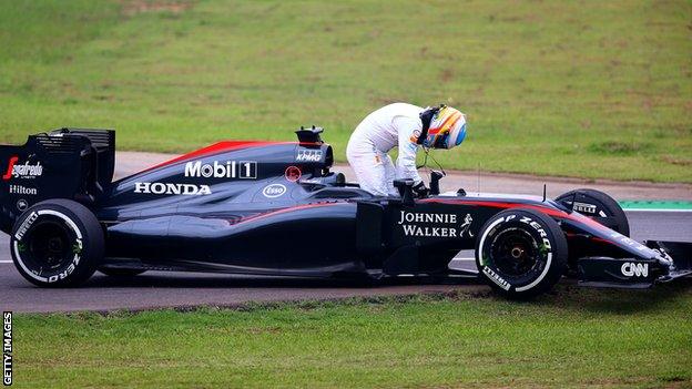 Fernando Alonso with broken down McLaren car at the 2015 Brazilian Grand Prix practice run