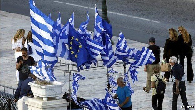 A street vendor in Athens selling Greek and EU flags