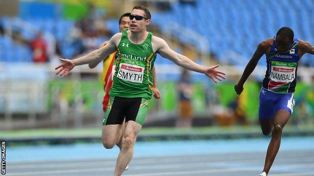 Jason Smyth celebrates after winning a third successive T13 100m title