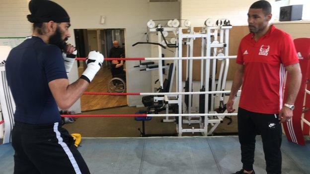 Karam Singh in the ring with trainer Wayne Elcock in Birmingham