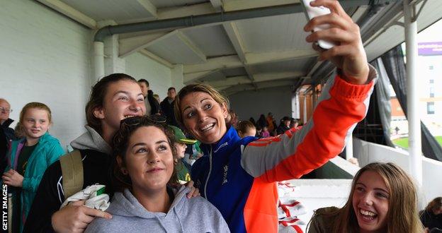 England captain Charlotte Edwards poses for a selfie with fans