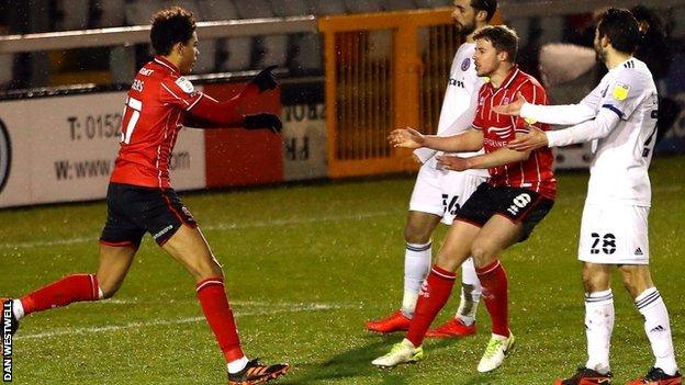 Lincoln looked to have turned the contest with the first of the Imps' two second-half goals from Morgan Rogers