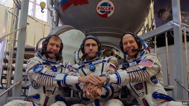 (L-R) Tim Peake, Russian cosmonaut Yuri Malenchenko and US astronaut Tim Kopra