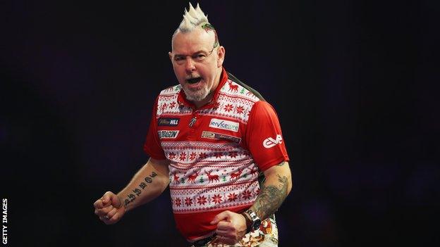 Peter Wright celebrates victory at the PDC World Championship