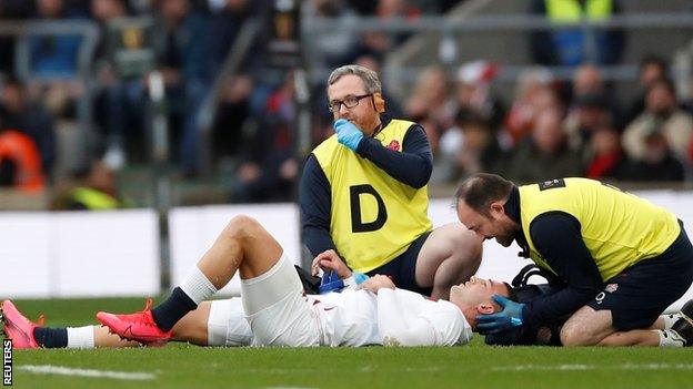 Jonny May receives treatment on the pitch