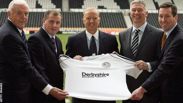 Paul Jewell and the new Derby owners appear on the Pride Park pitch