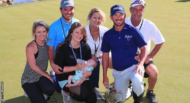 Andrew Landry poses with his family and the Texas Open trophy