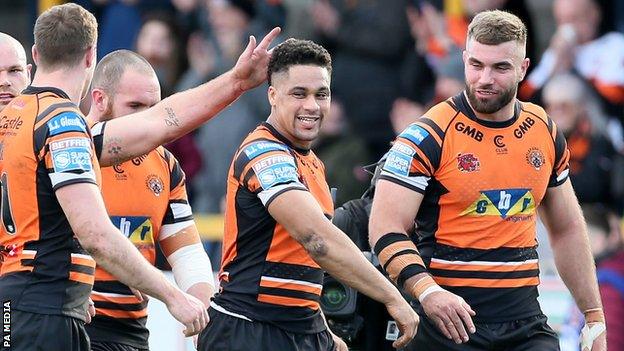 Derrell Olpherts celebrates his second try for Castleford