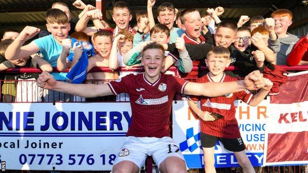 Kelty Hearts' Max Kucheriavyi celebrates with fans