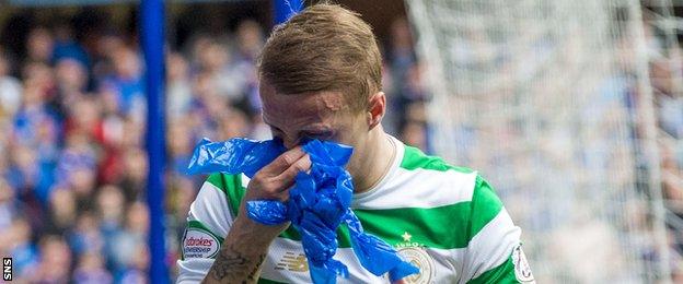 Celtic striker Leigh Griffiths blows his nose on some blue tissue paper